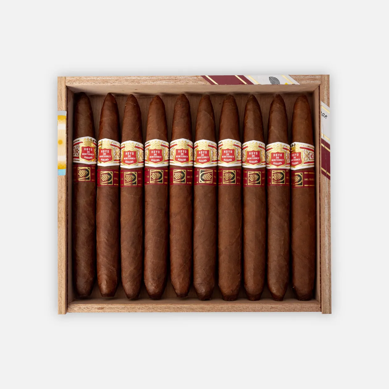 Hoyo de Monterrey Excalibur cigars in elegant red and gold packaging.