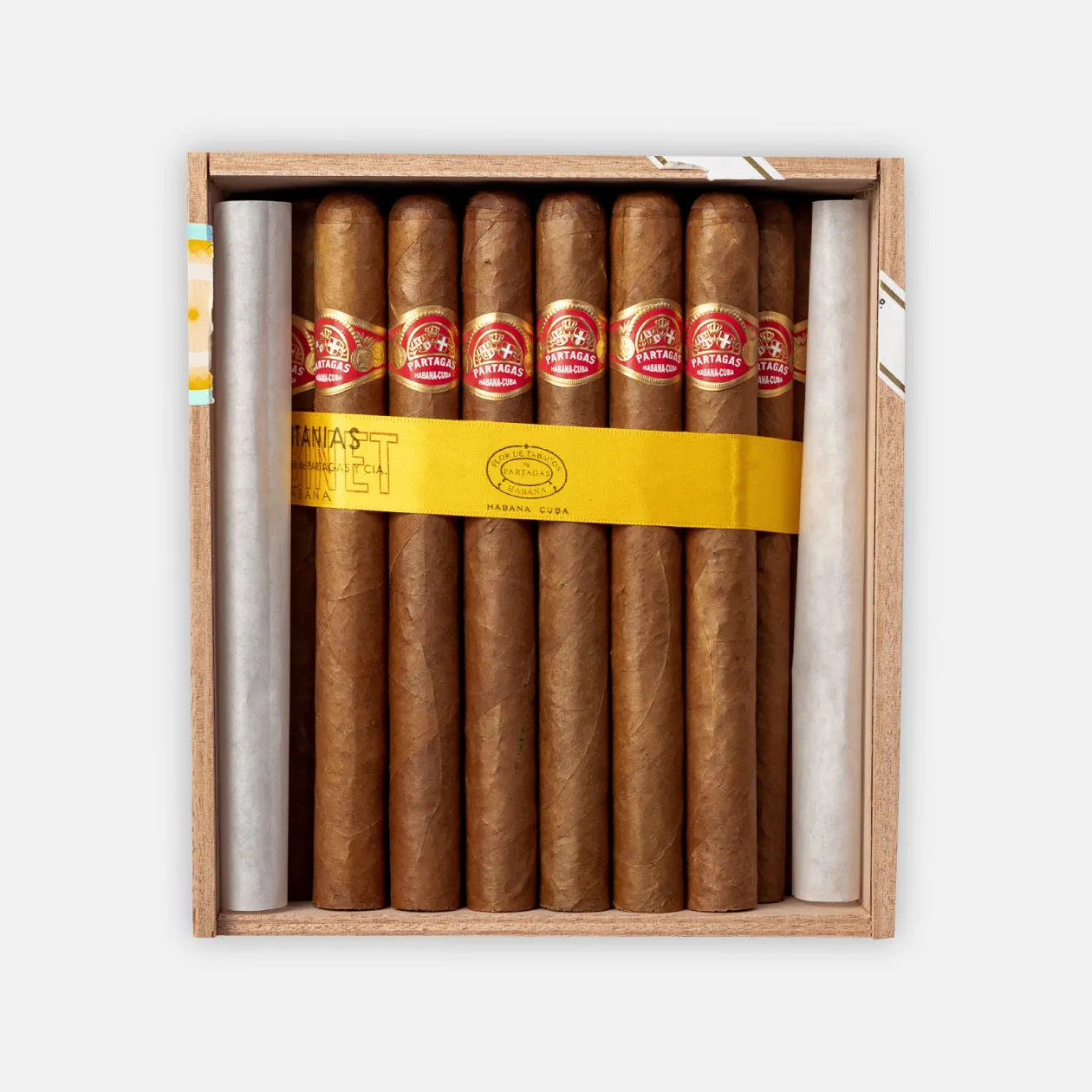 Partagás cigars in a wooden box with a yellow band.